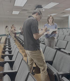 Students talking during student body meeting for Graduate Student Association