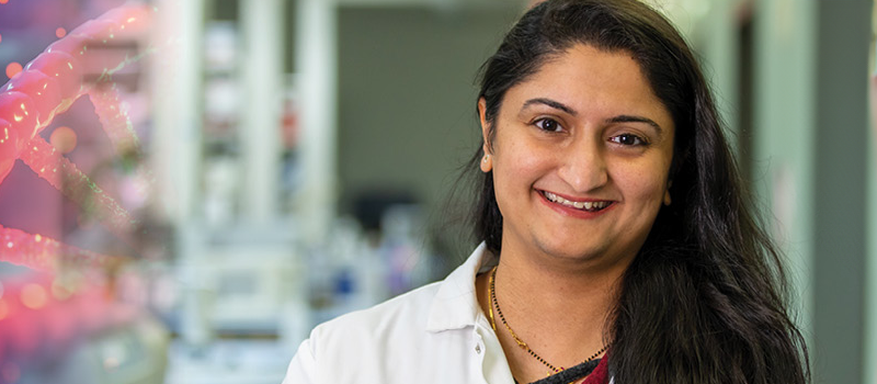 Researcher smiling at camera